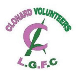 Logo of Clonard Volunteers Ladies Gaelic Football Club. Shows a pink letter C with a green pike piercing through it, The words clonard volunteers arch overhead in pink and green and arching underneath are the lettters L.G.F.C in alternating pink and green colouring.
